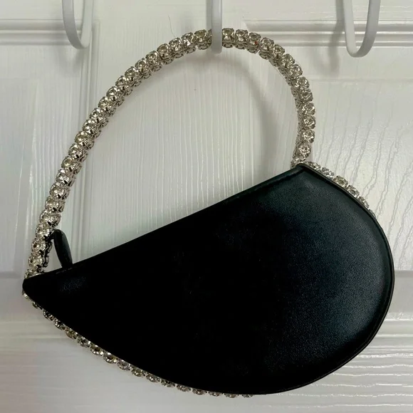 Small, black Akira, heart-shaped